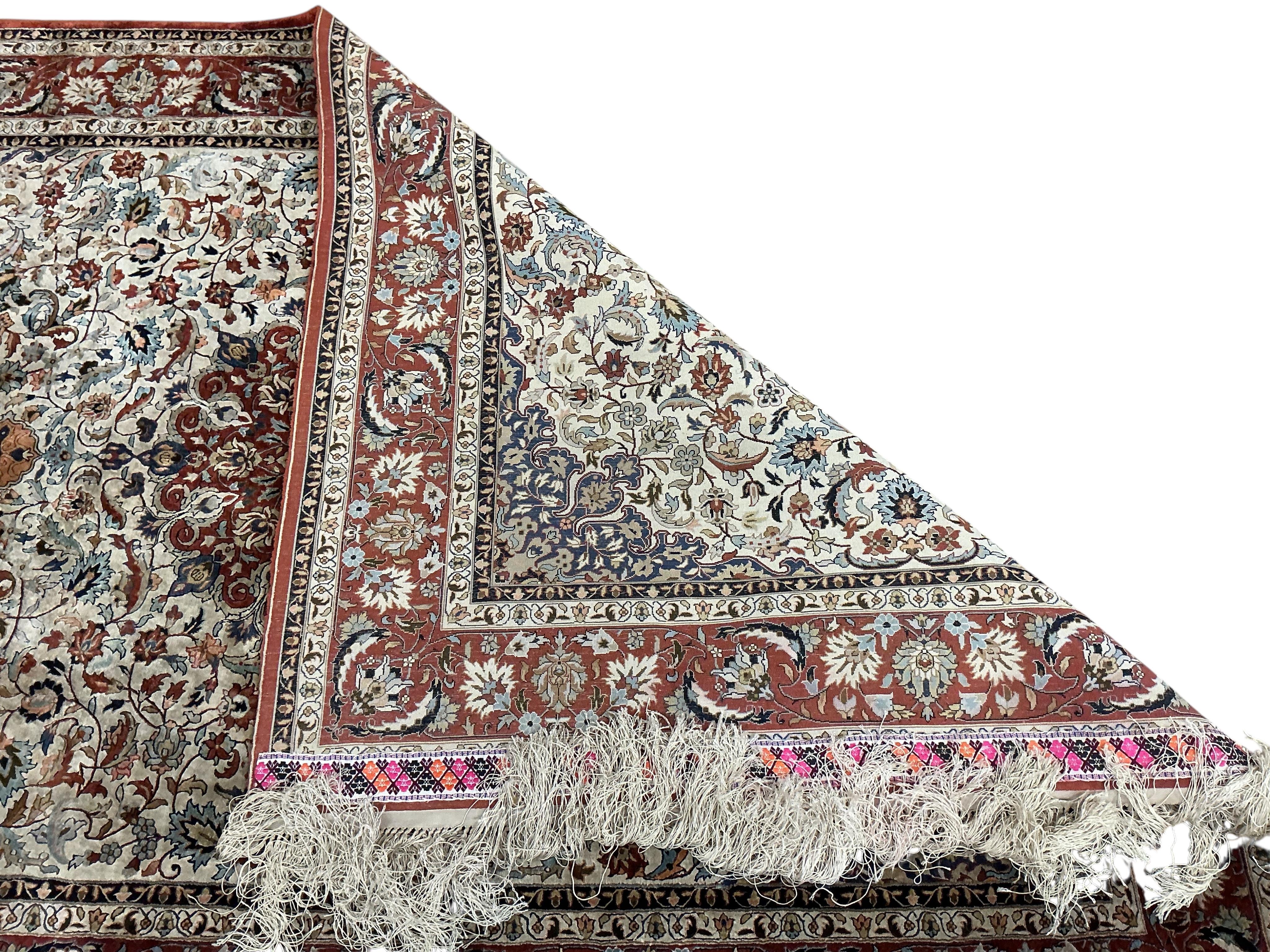 A North West Persian part silk ivory ground rug, 184 x 126cm